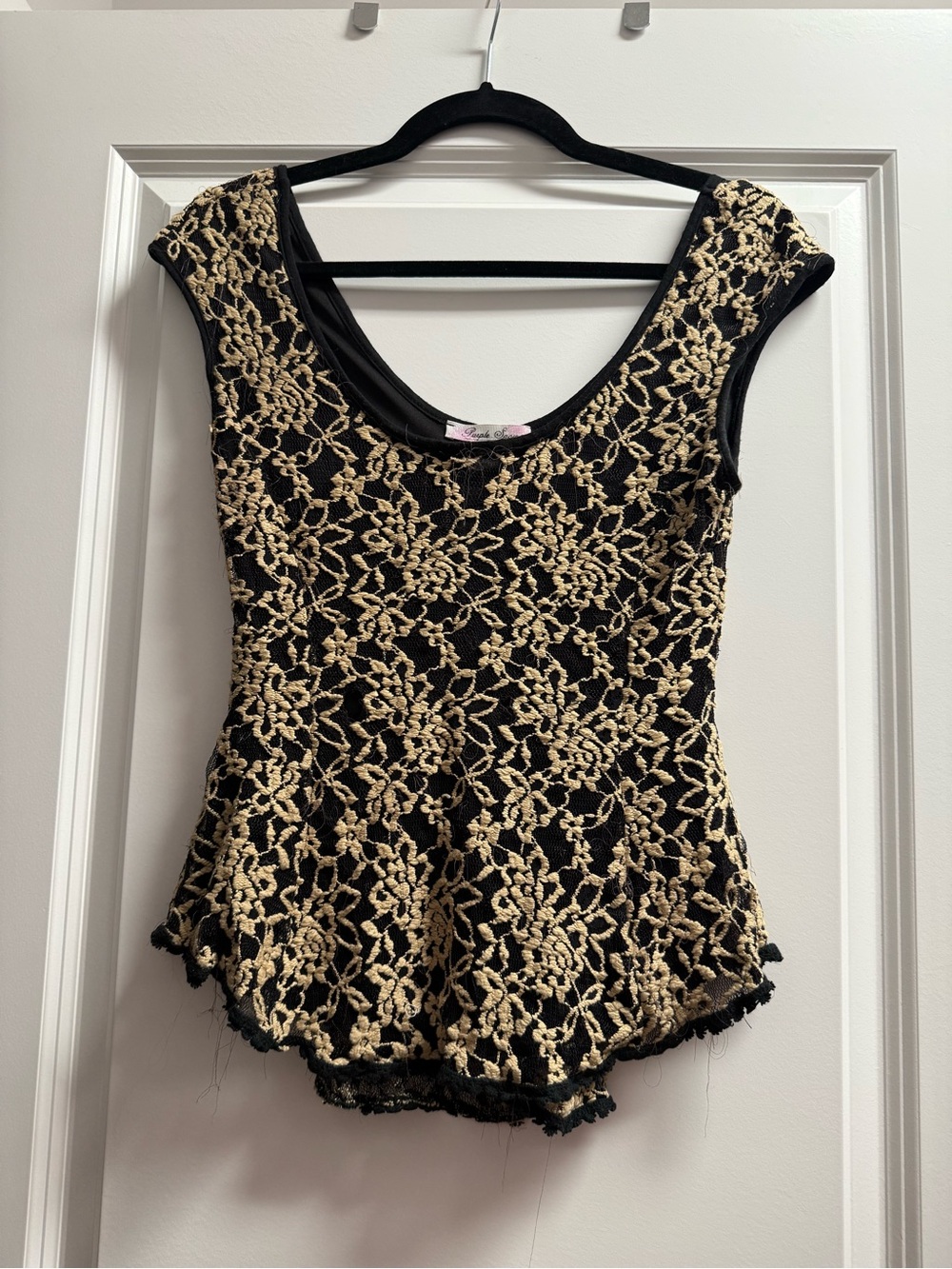 Black peplum with cream floral